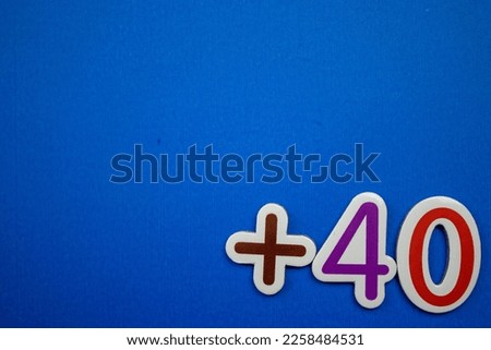 Colorfully written +40 on the bottom right of the blue background.