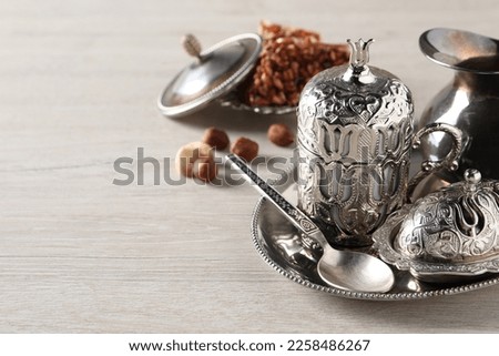 Tea and Turkish delight served in vintage tea set on wooden table, space for text