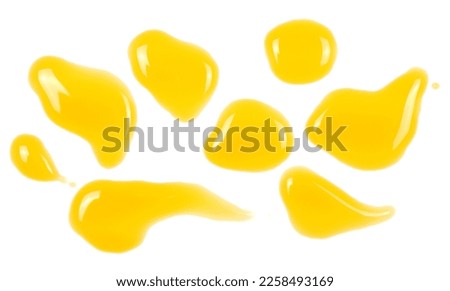 Puddle of orange and mango juice isolated on white background, clipping path, top view Royalty-Free Stock Photo #2258493169