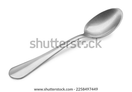 New clean shiny spoon isolated on white Royalty-Free Stock Photo #2258497449