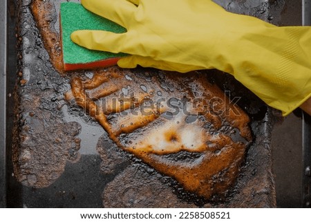 wash grease, cleaning the kitchen and washing the oven from greasy cooking residues Royalty-Free Stock Photo #2258508521