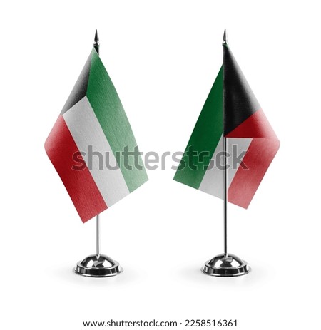 Small national flags of the Kuwait on a white background. Royalty-Free Stock Photo #2258516361