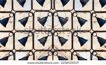Christmas Decoration. Symmetric Rustic Fence decorated with Bells