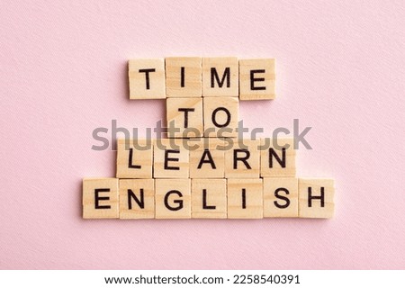 Time to learn English. Language concept. Pink background.