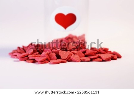 Medical bottle full of red hearts on white background, healthcare and love concept. Valentine's day. Love pills. Royalty-Free Stock Photo #2258561131