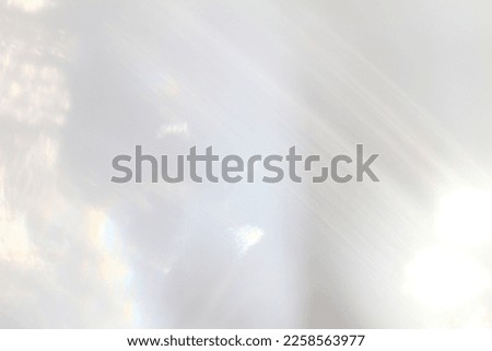 Abstract background - light flashes on grey background. Royalty-Free Stock Photo #2258563977