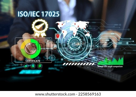 Business man is using computers to work on ISO IEC 17025, the accreditation work system for testing and calibration laboratories. Royalty-Free Stock Photo #2258569163