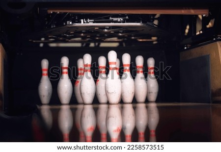 Players of all ages gather at the bowling alley for a night of friendly competition and endless fun. Striking it big is the goal