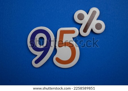 Colorfully written 95 percent on a blue background. Royalty-Free Stock Photo #2258589851
