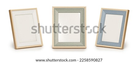 Desktop photo frame, Vertical standing brown wooden picture frame on white background, Royalty-Free Stock Photo #2258590827