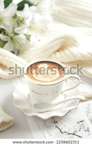 A cup of coffee latte in brightmood photography.