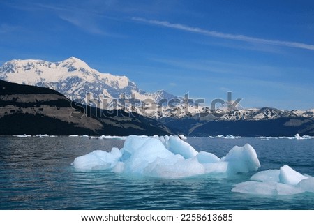 Alaska, iceberg in Icy bay in Wrangell St. Elias National Park and Preserve, with Mount Saint Elias in the background Royalty-Free Stock Photo #2258613685