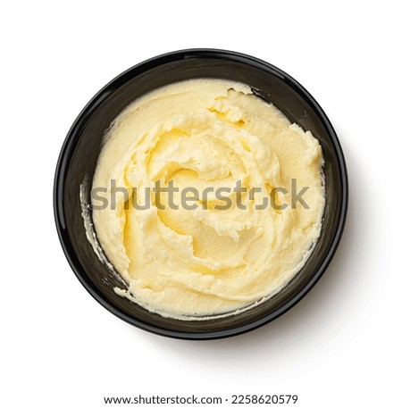Mashed potato in black bowl isolated on white background, top view Royalty-Free Stock Photo #2258620579