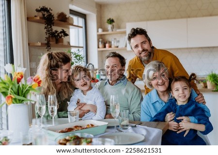 Portrait of happy multigenerational family during Easter dinner. Royalty-Free Stock Photo #2258621531