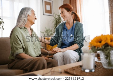 Nurse cosulting with senior her health condition. Royalty-Free Stock Photo #2258621913
