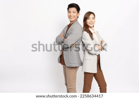 Portrait of successful business asian couple in suit with arms crossed and smile isolated over white background Royalty-Free Stock Photo #2258634417
