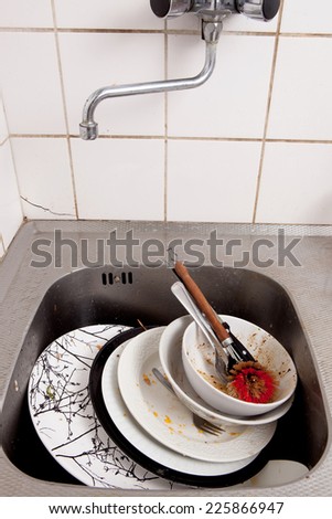 Dirty dishes in kitchen sink