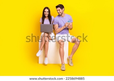 Full size photo of cute woman man laptop device apple macbook samsung dressed stylish violet look isolated on yellow color background