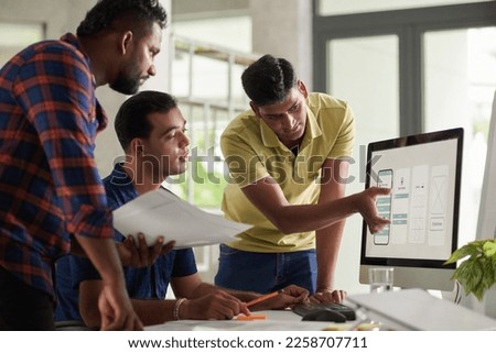 Art director telling UX designers what to correct in application design Royalty-Free Stock Photo #2258707711