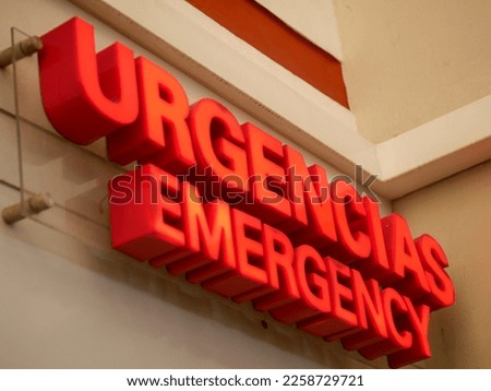 urgencias emergency red sign in a wall