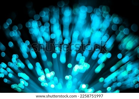 Background aqua blue dots and bubbles from the fibre optic