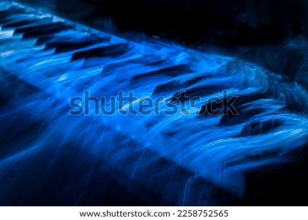Blue piano keys with blue fibre optic light 