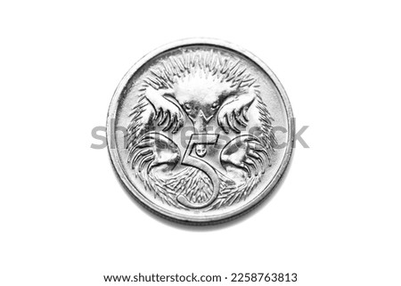 Australian dollar coin, isolated on white background with soft shadow, close up.
