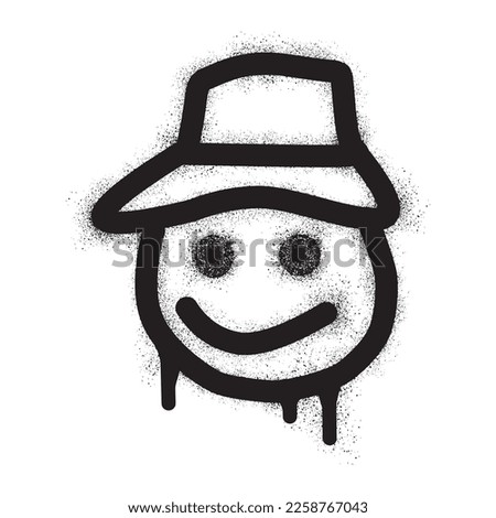 Smiling face emoticon wearing baseball cap with black spray paint
