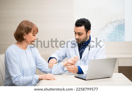 Woman entering old age, Attend an annual health and check-up and discussion with doctor in hospital