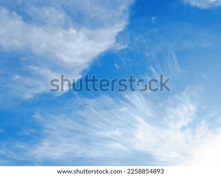 Clouds like Angel wings Daytime sky with Cirrus clouds formation with blue sky, detached, hair-like clouds. These delicate clouds are wispy, with a silky sheen at autumn day