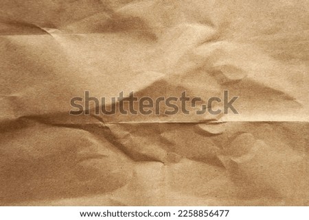 Creased Hard pale brown color environmental friendly wrap blank organic paper texture background with space minimal style design for packaging Royalty-Free Stock Photo #2258856477