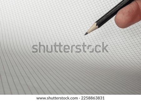 Chart or graph with hand holding pencil and room for text