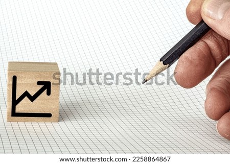 Investment icon with hand holding pencil and room for text