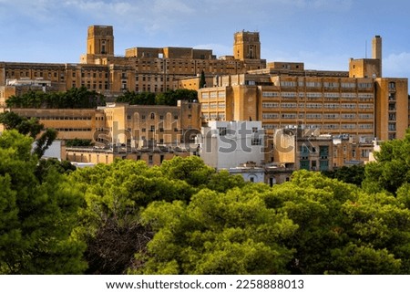 Pieta town skyline in Malta, townscape with historic St. Luke Hospital on the right. Royalty-Free Stock Photo #2258888013