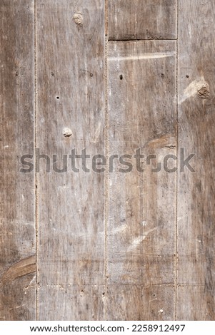 Old wooden exterior door full frame background texture Royalty-Free Stock Photo #2258912497