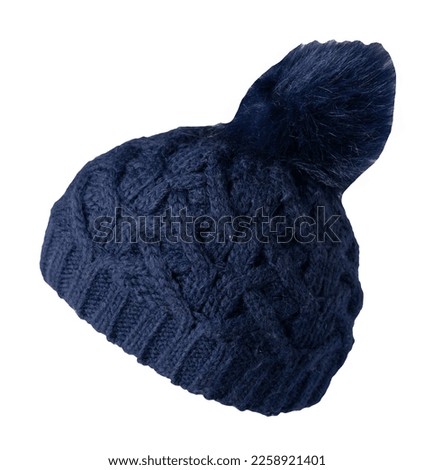   knitted dark blue hat isolated on white background.hat with pompon .