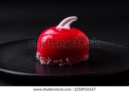 Beautiful tasty cake red color cheesecake in the shape of a heart. Sweets for Valentine's Day