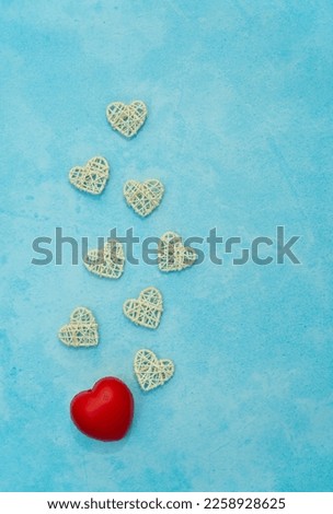 Valentines day love image, red and white heart shape on a aqua colour background