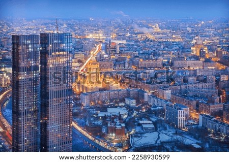 View of the city from the observation deck to skyscrapers in the light of night lights, the Ministry of Foreign Affairs and the Hotel, Moscow City 
 Royalty-Free Stock Photo #2258930599