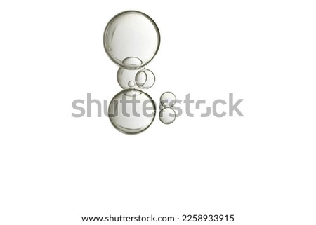 Beautiful light beige water blobs, isolated over a white background. Royalty-Free Stock Photo #2258933915