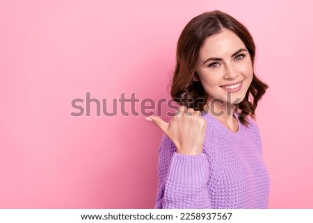 Photo of pretty cute lady wear stylish purple clothes arm thumb presenting empty space positive feedback isolated on pink color background