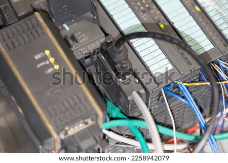 Industrial connector connecting to the PLC CPU unit, Automation System in industrial. Royalty-Free Stock Photo #2258942079