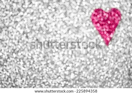 Silver glitter sparkle confetti background or party invitation with pink heart for happy birthday card, Valentine's Day poster, bridal texture, anniversary design or Christmas celebration