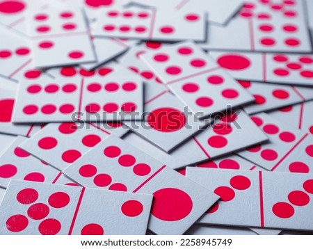 Domino playing cards scattered on the table
