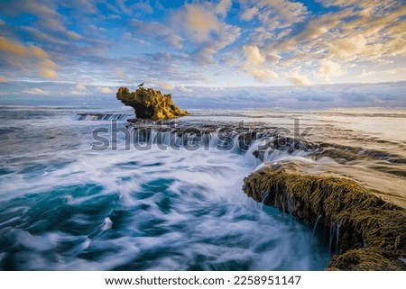 This iconic rock formation commonly known as 'Dragon's Head' sits along the Rye back beach not far from the Melbourne CBD. Royalty-Free Stock Photo #2258951147