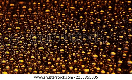 Water drops. Texture of the drops. Abstract gradient background. golden gradient. Heavily textured image. Shallow depth of field. Selective soft focus