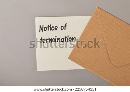 Brown envelope and white paper written with NOTICE OF TERMINATION