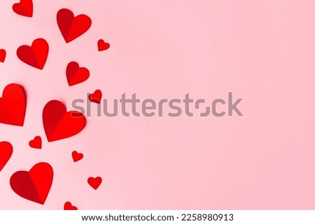 Paper hearts over the blue pastel background. Abstract background with paper cut shapes. Sainte Valentine, mother's day, birthday greeting cards, invitation, celebration concept