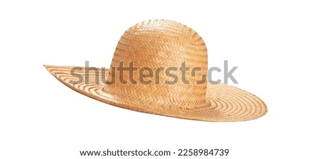 Pretty straw hat with ribbon and bow on white background. Beach hat top view isolated on white background. Royalty-Free Stock Photo #2258984739
