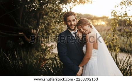 Wedding, love and portrait of couple in garden for marriage, ceremony celebration and commitment. Save the date, trust and bride and groom hug, embrace and happy for romance, loving and peace in park